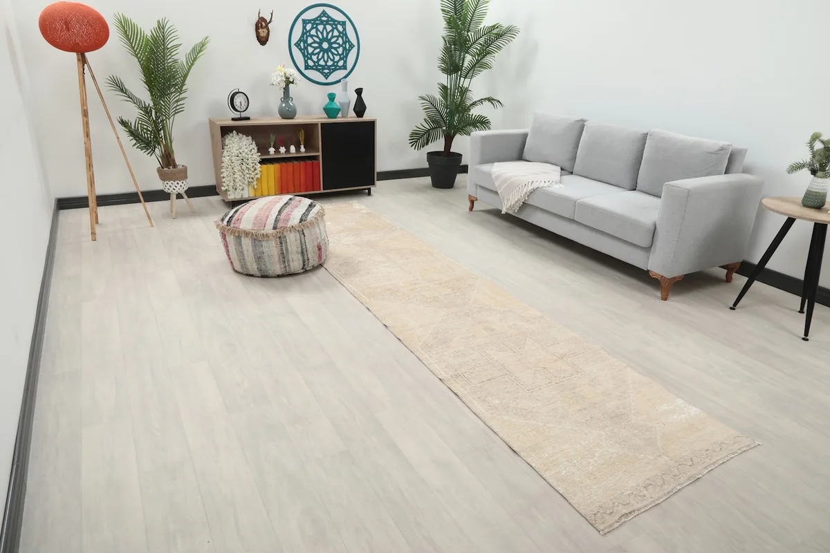 Long view of the beige Anatolian runner rug extending through a contemporary living space.