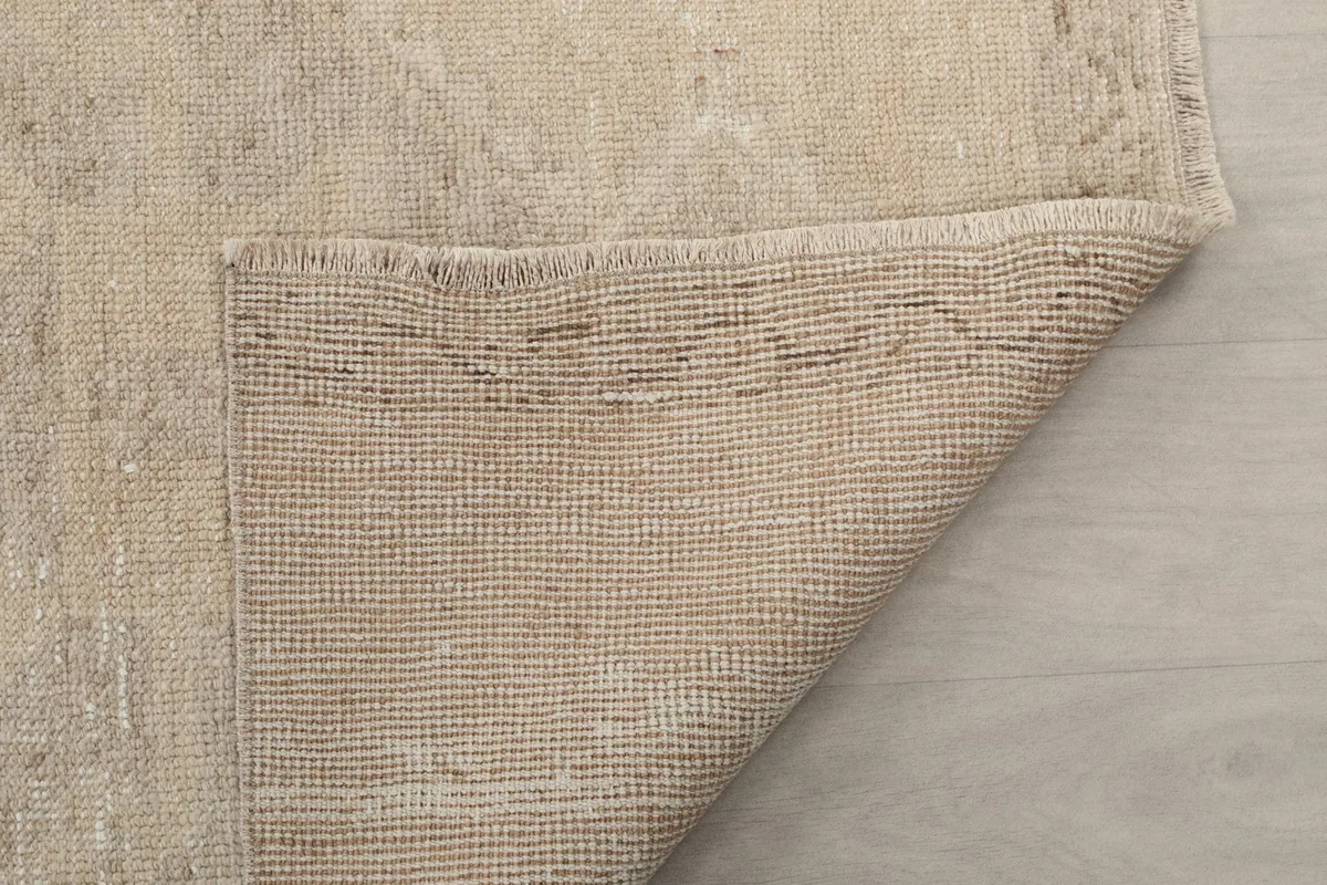 Another view of the rug's backside, revealing the tight hand-knotted construction.