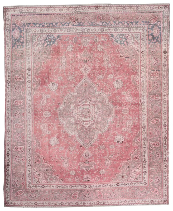 Full overhead view of the rose Anatolian medallion rug on a white background