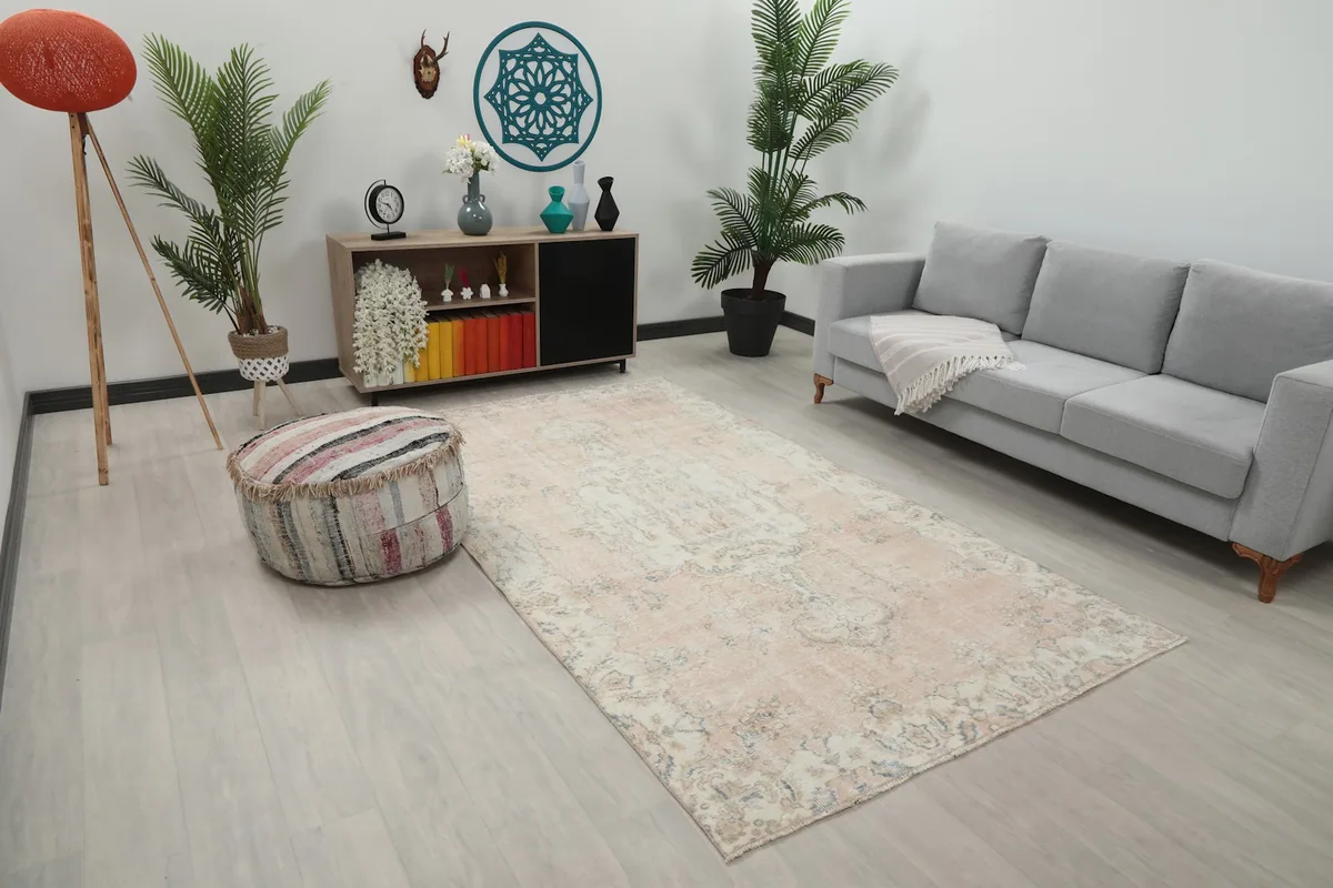 Room view of the vintage rug from a slightly different angle, highlighting its placement.