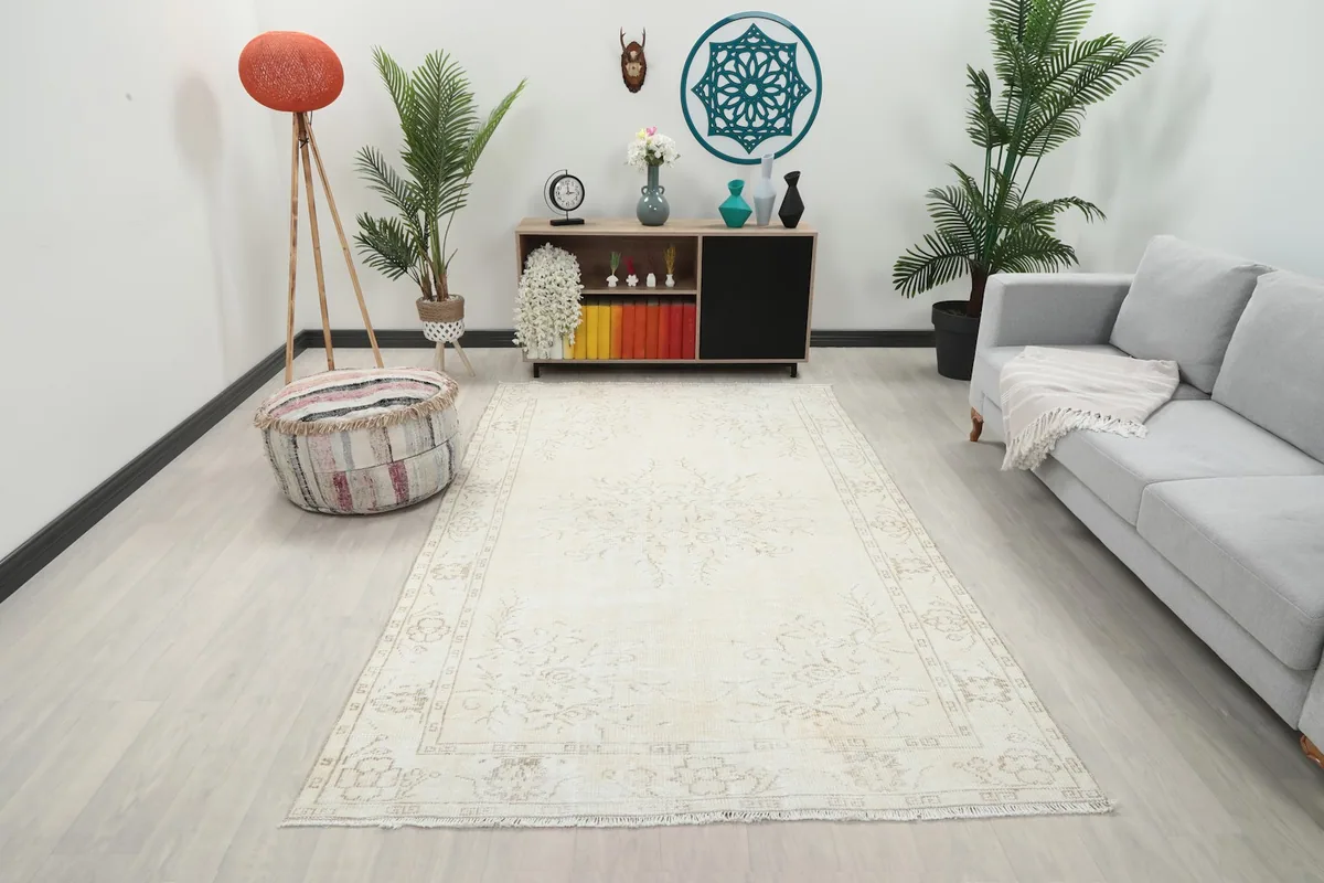Vintage Anatolian rug displayed in a living room setting from a wide angle