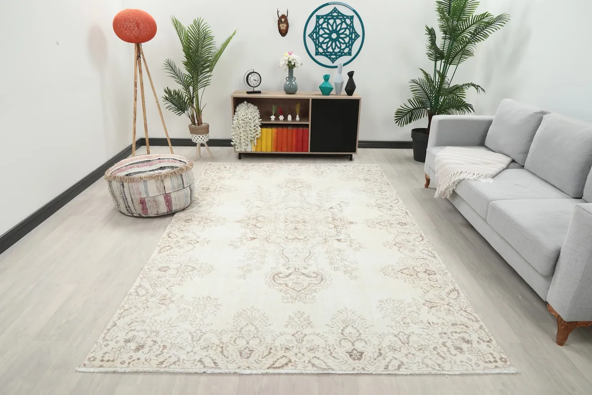Vintage Anatolian rug in a modern living room setting with a gray sofa