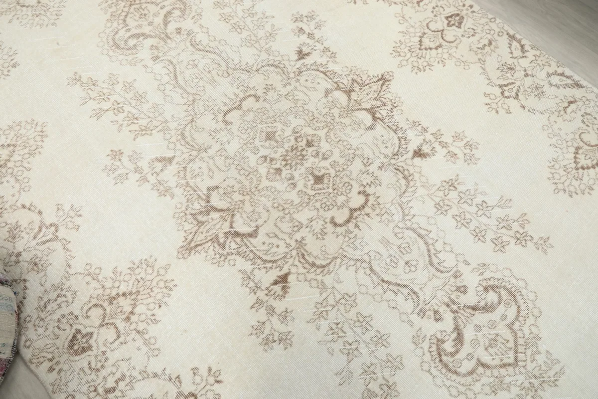 Overhead detail of the rug's central floral medallion design
