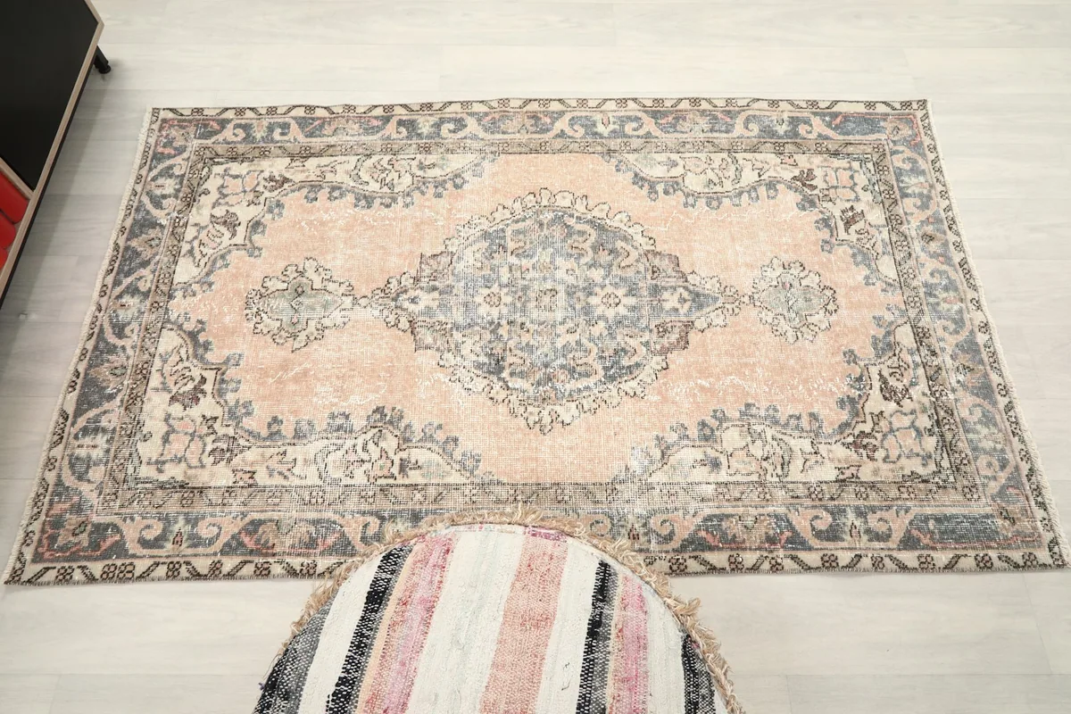 Direct overhead shot of the rug on the floor, capturing the entire design and color variation