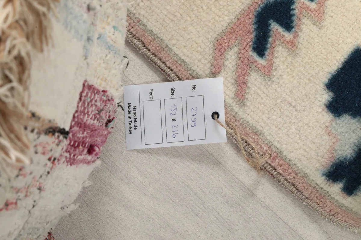 Tag on the back of the rug indicating its dimensions and origin from Turkey