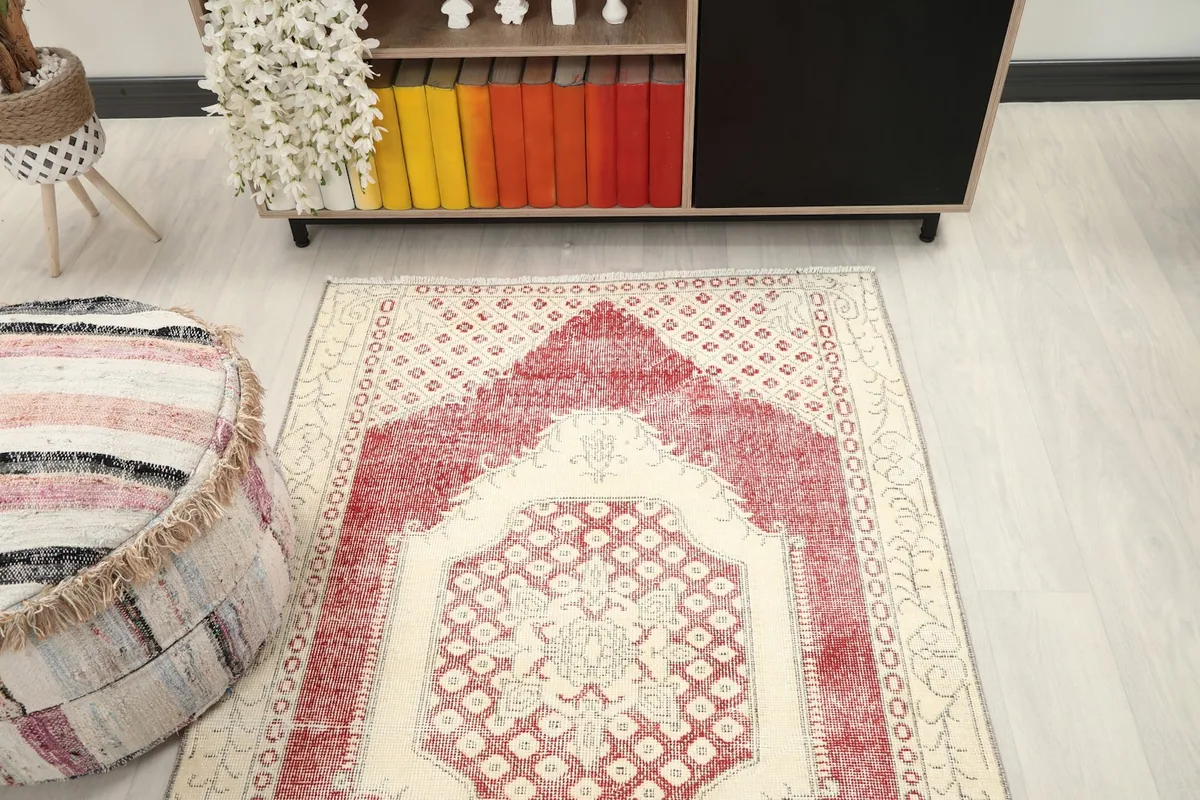Angled view looking down at the rug in the room, showing its full design