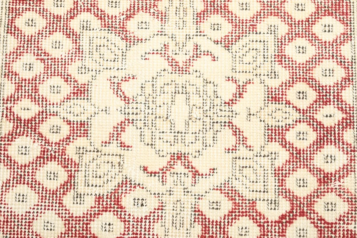 Detailed view of the distressed wool pile showing the texture and color variations
