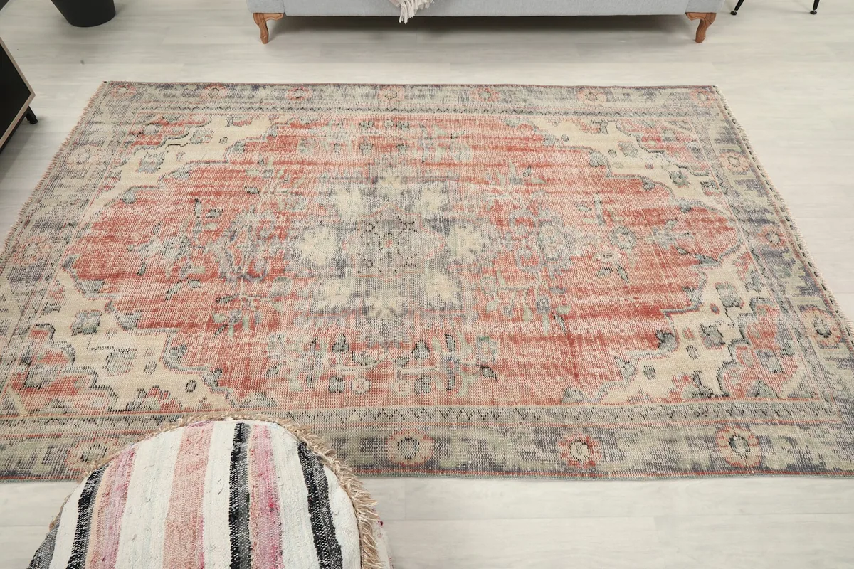 Full overhead view of the vintage Anatolian rug, highlighting its medallion and color variation