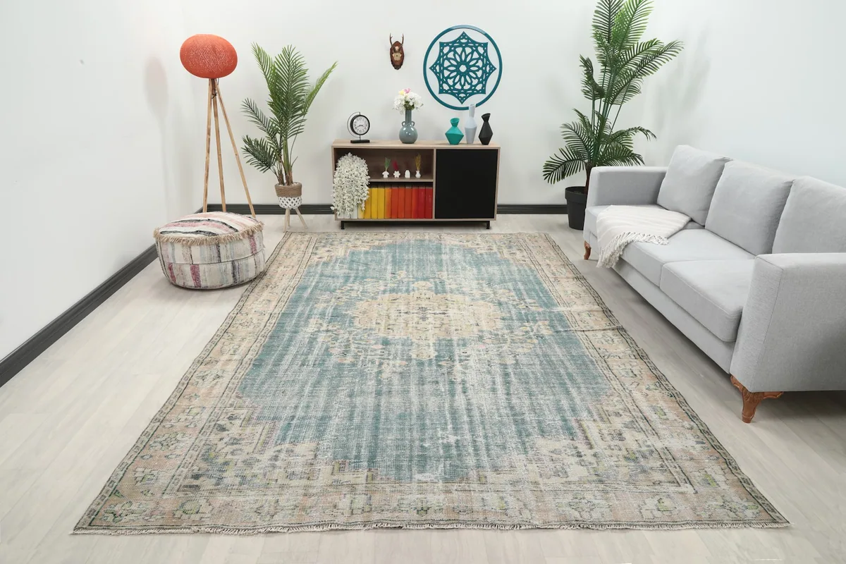 Vintage blue and beige rug displayed in a modern living room setting