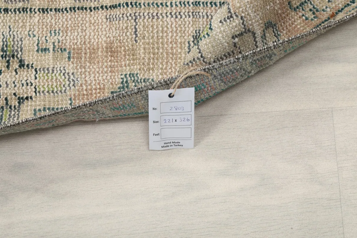 Corner of the rug with the product tag showing size and origin