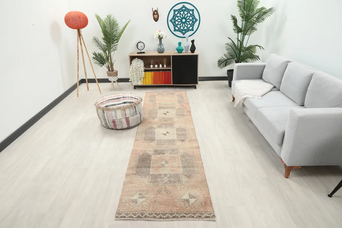 Vintage rust and gray geometric runner rug displayed in a modern living space