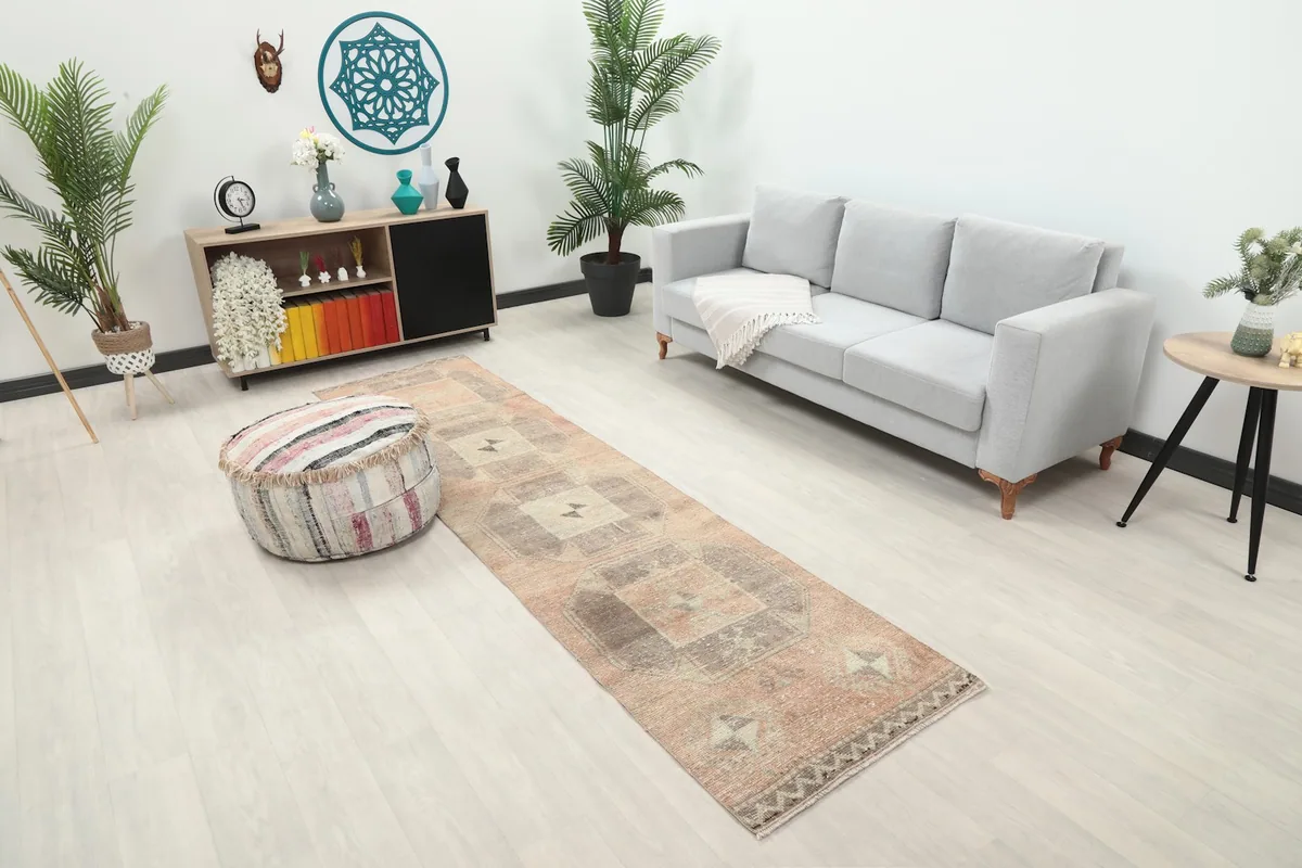 Overhead view of the Anatolian runner rug in a room setting with a light gray sofa