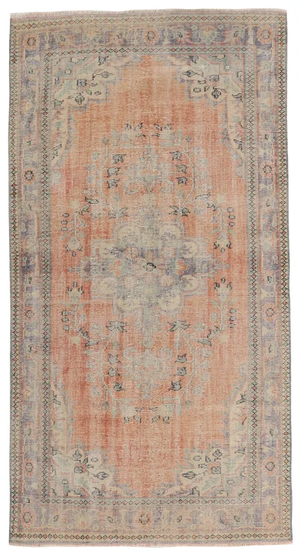 Full top view of the vintage rust Anatolian area rug on a white background