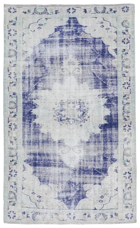 Full overhead view of the blue and ivory vintage Anatolian area rug