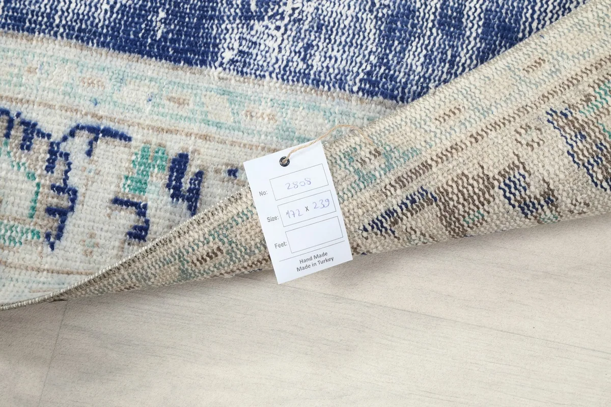 Product tag displaying the rug's size and origin details