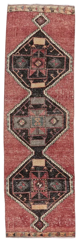Full overhead view of the rust and black geometric vintage Anatolian runner rug