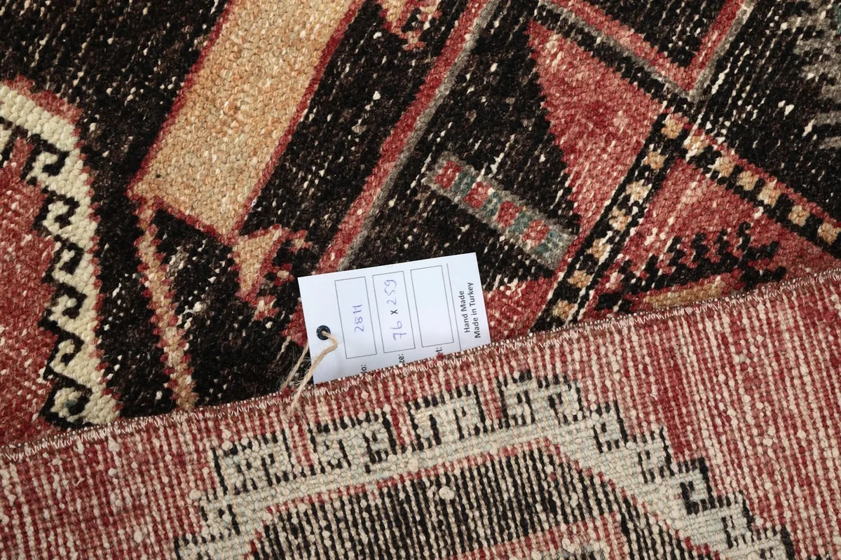 Close-up of the rug's label confirming its size and details, partially visible