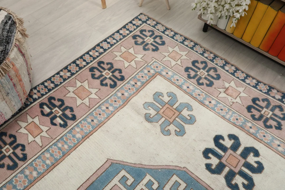 Corner view of the rug, highlighting the intricate border and field patterns.