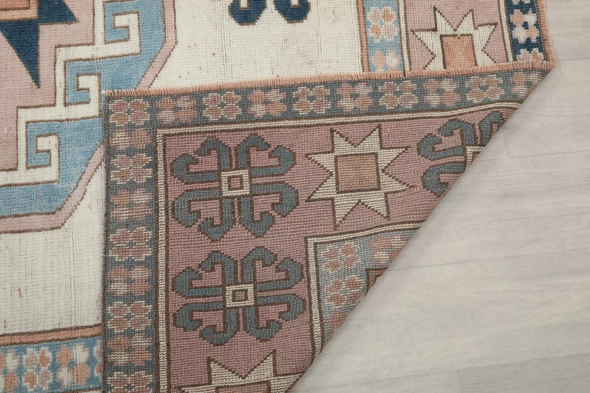 Another view of the rug's reverse side, showing the dense knotting and wool foundation.