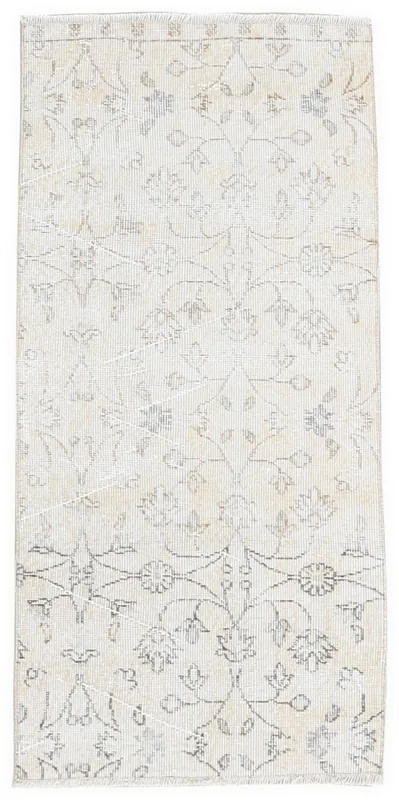 Full top view of the cream floral vintage Anatolian area rug on a white background