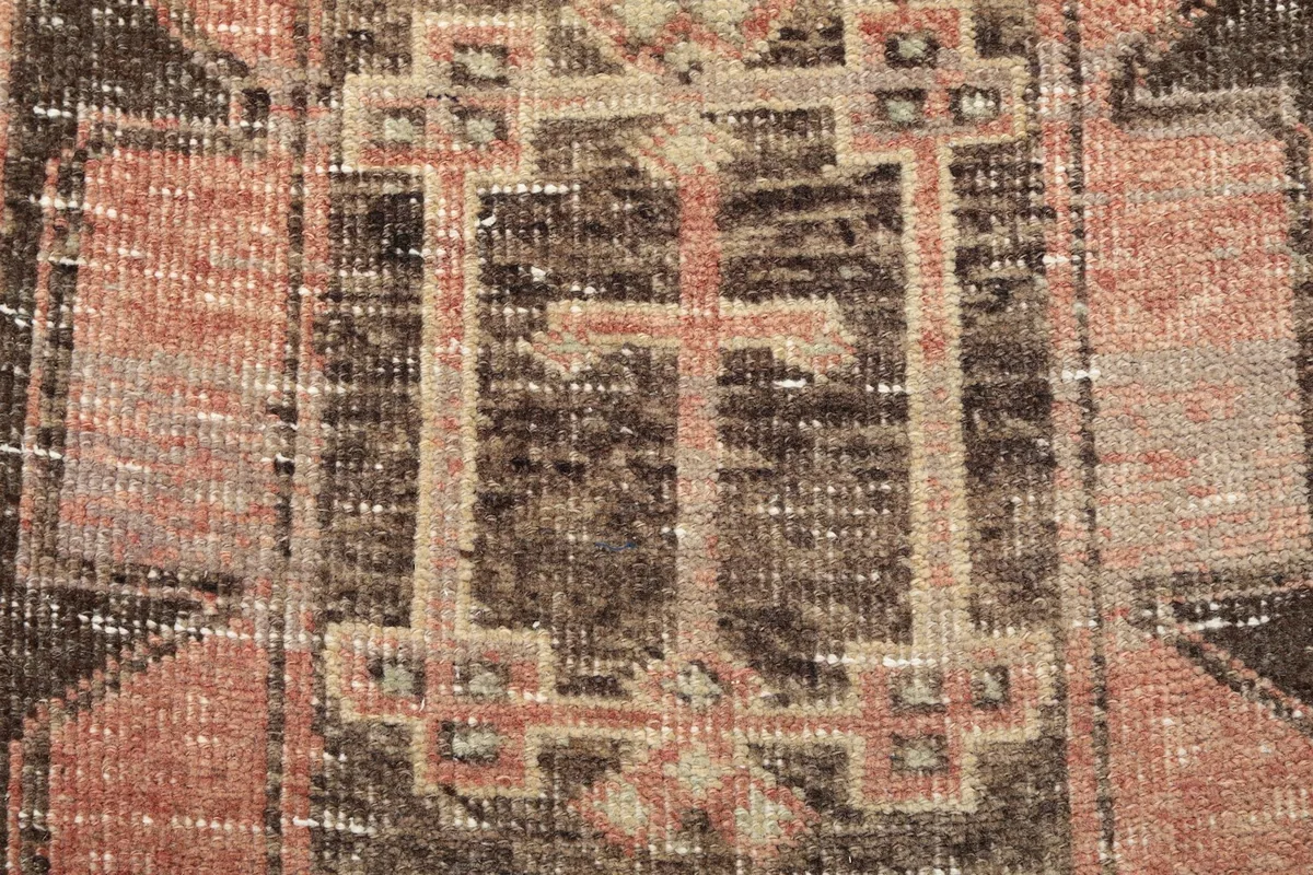 Detailed view of a central medallion-like geometric pattern with subtle color variations