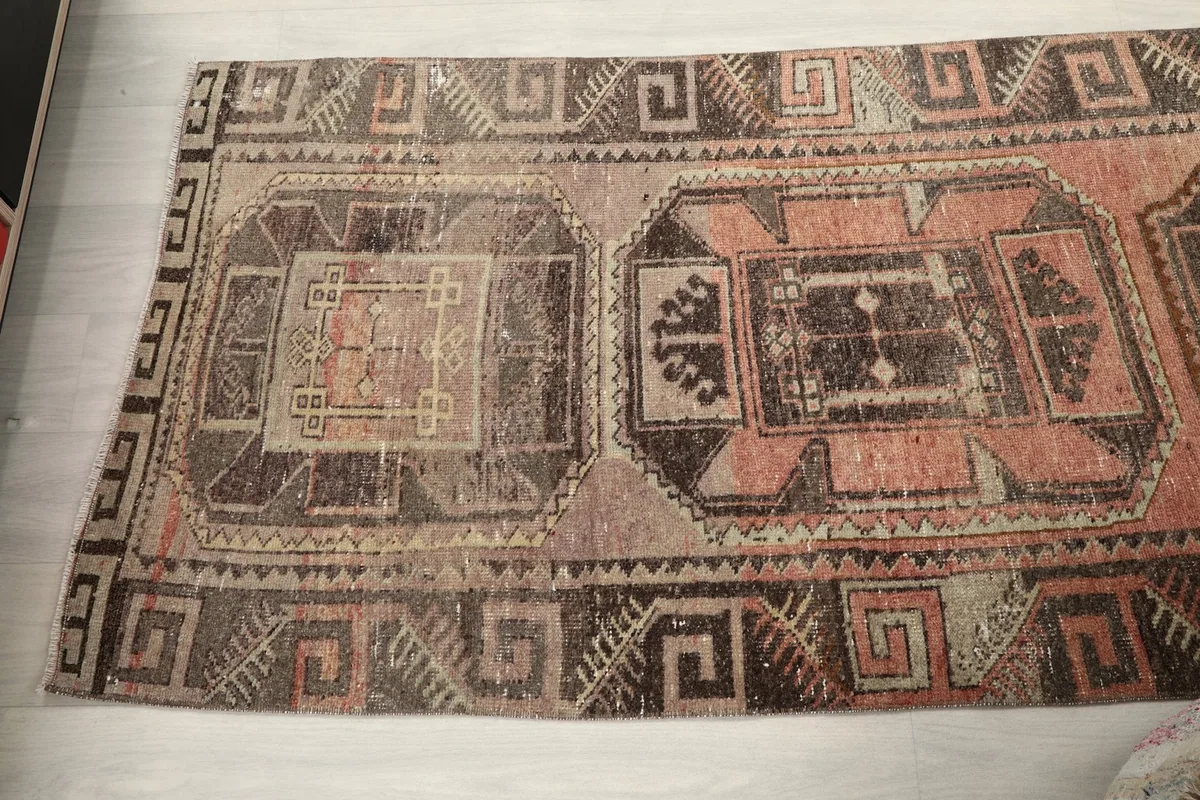 Overhead view of a section of the runner rug, showcasing multiple geometric panels