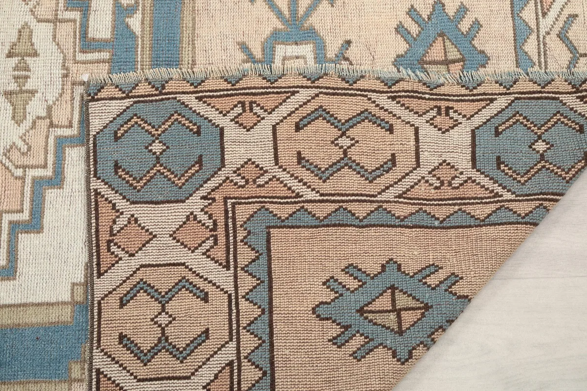 Another folded corner, showcasing the construction and the reverse side of the rug