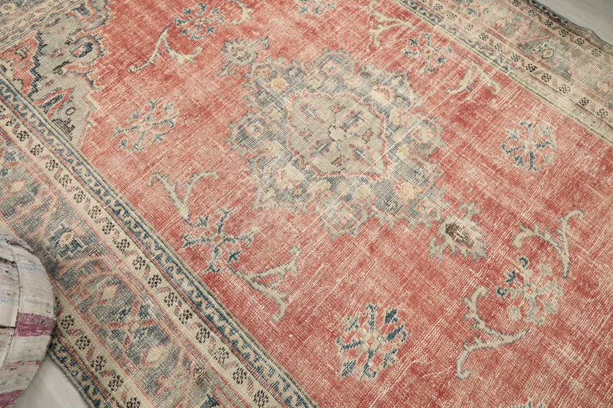 Top-down view of the central medallion and rust field with subtle blue tones