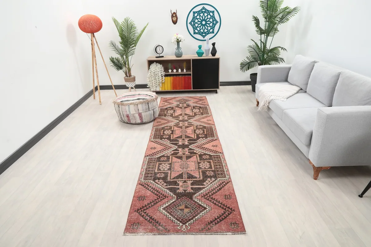 Vintage Anatolian runner rug in a modern living space, showing its full length and design.