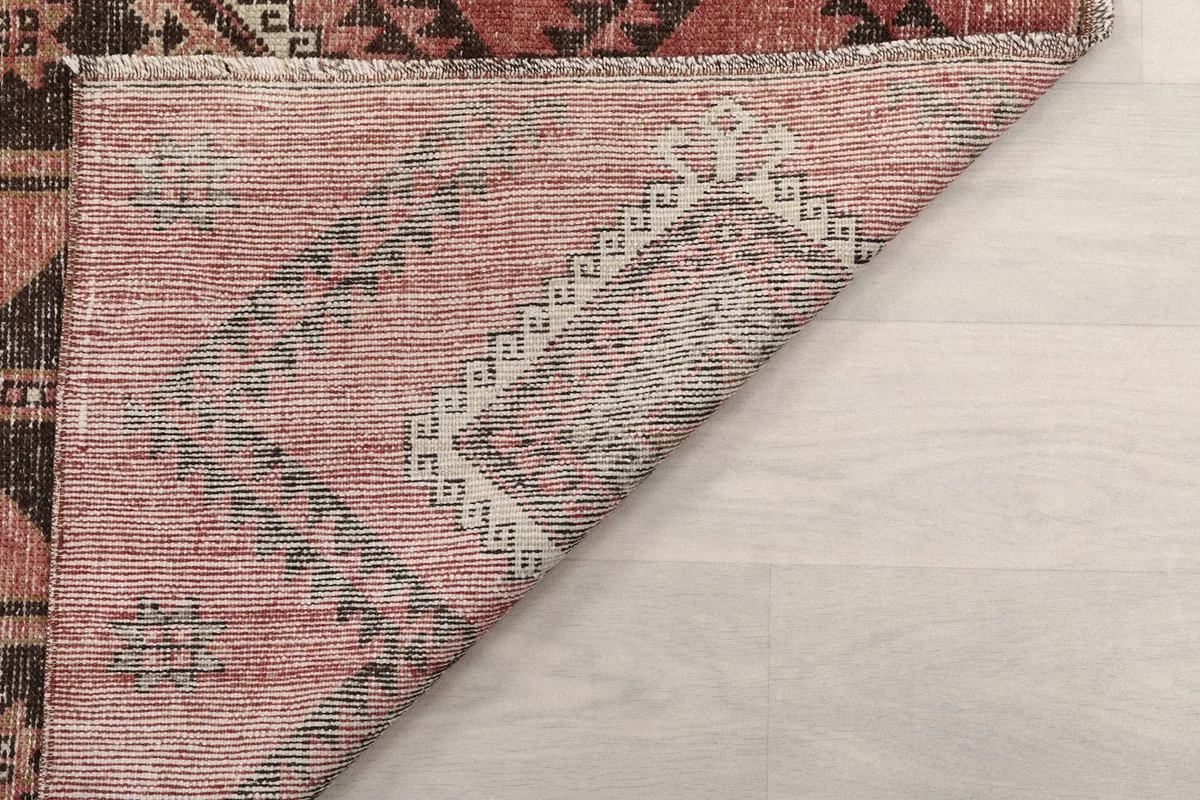 Close-up of the low pile of the vintage wool runner, revealing its texture and weave.