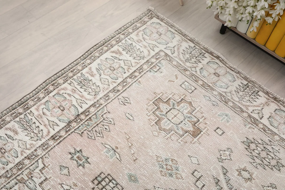 Corner view of the rug showing the border and field patterns