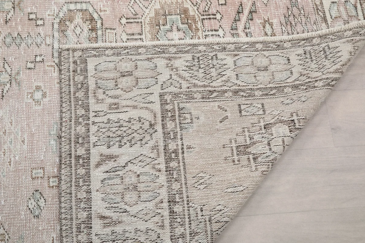 Another folded corner of the rug showing the reverse side and knotting