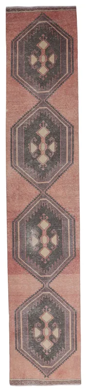 Full top view of the vintage rust geometric Anatolian runner on a white background.