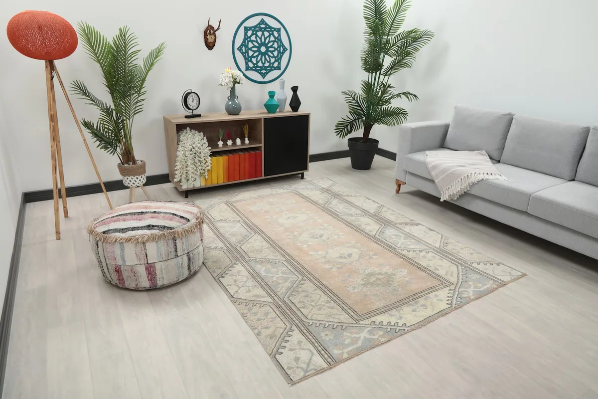 Angle view of the rug in a living room, showing its placement relative to furniture