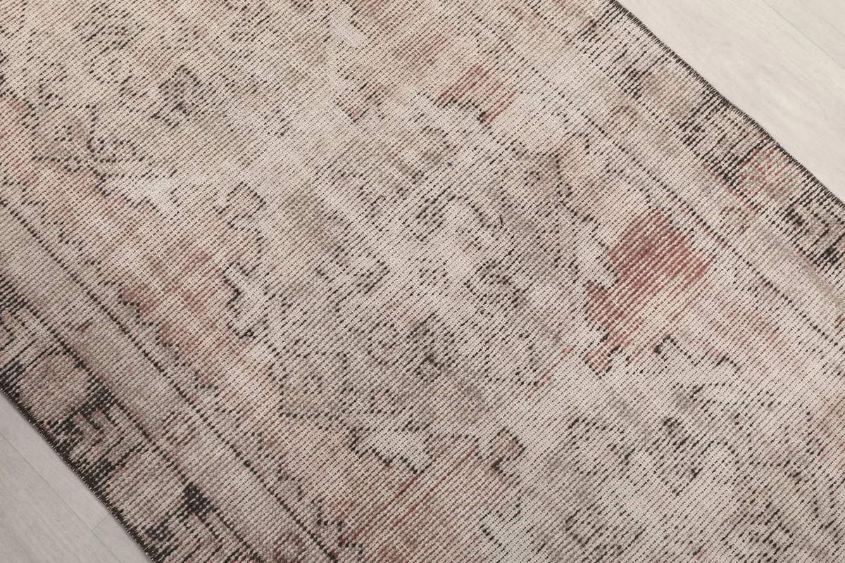 Close-up of the rug's central design, showing the intricate geometric patterns