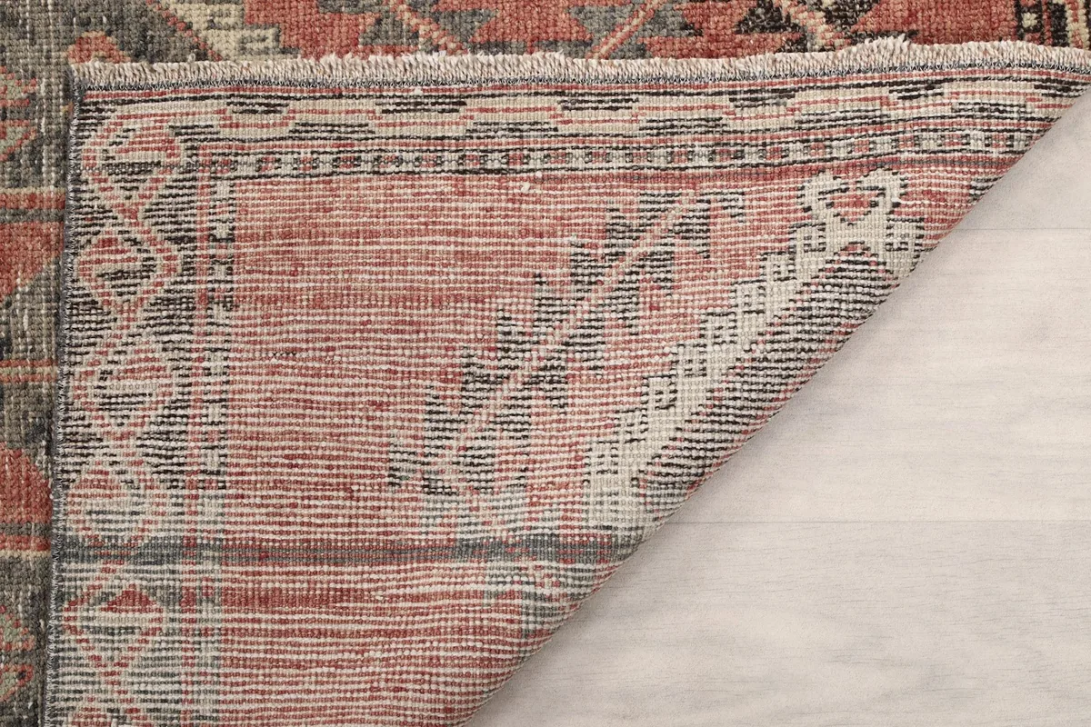 Underside view of the rug, showing the reverse of the hand-knotted construction