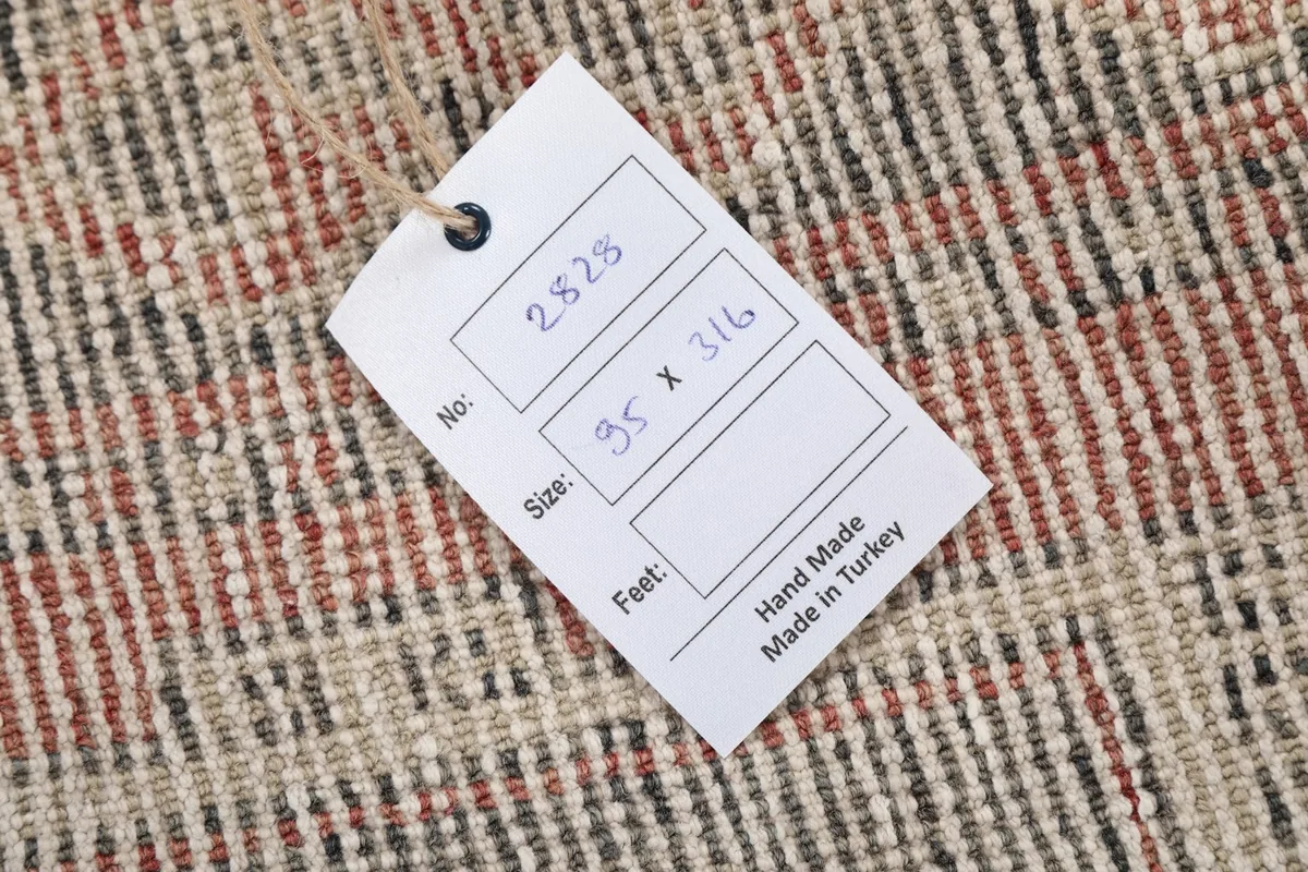 Close-up of the product tag with rug dimensions and origin details