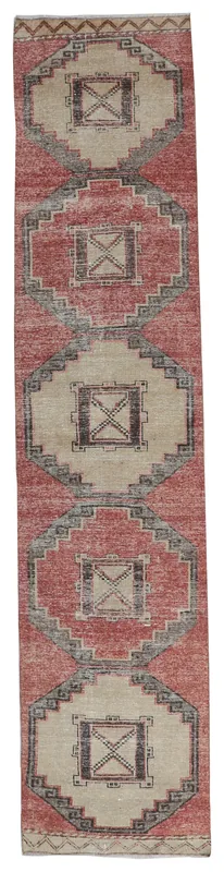 Full overhead view of the vintage rust and beige geometric Anatolian runner rug