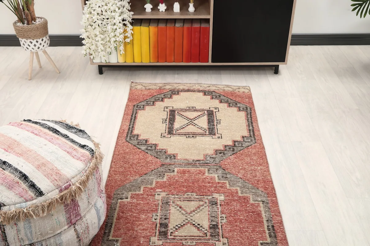 Overhead view of a section of the runner rug in a room, showing its geometric design