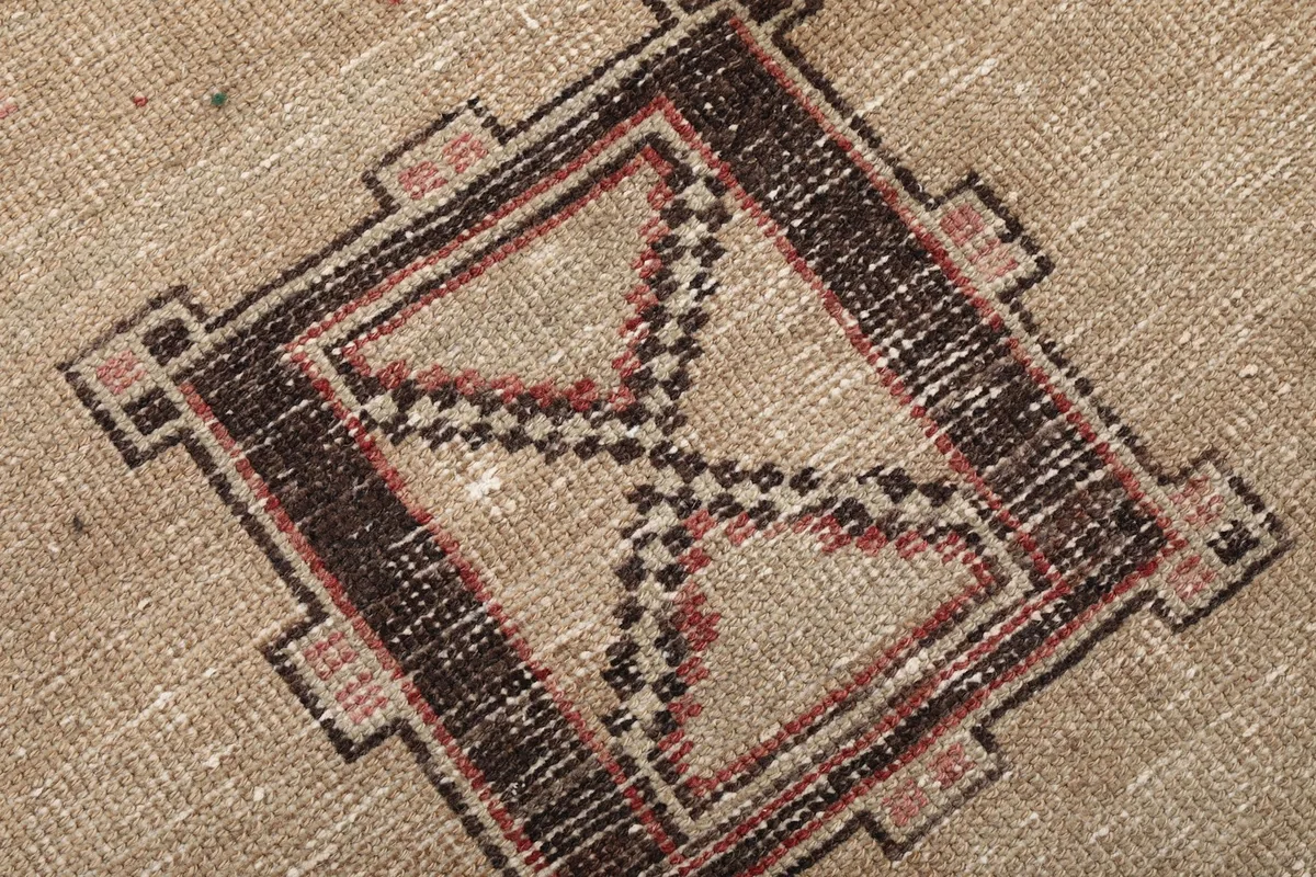 Close-up of the intricate tribal motifs and color variations within a medallion