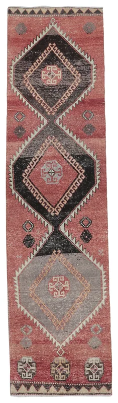 Full top view of the 2'9" x 12'0" rust geometric Anatolian runner rug on a white background