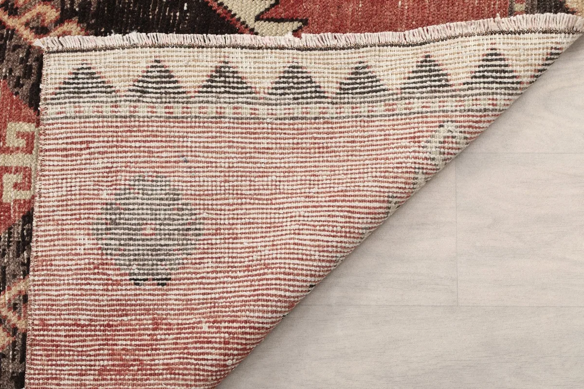 Another angle of the rug's back, revealing the tight weave and handcrafted quality