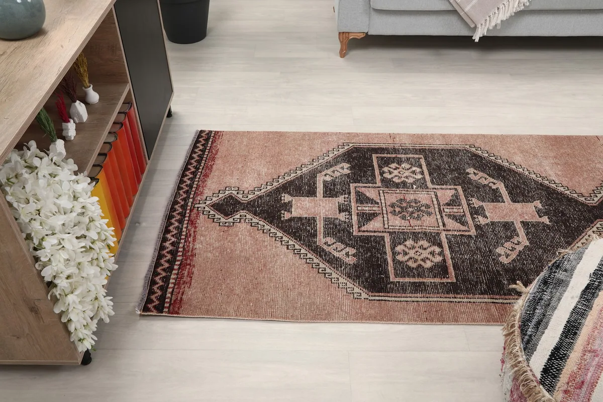 Another room view, focusing on the rug's length and how it anchors the space between furniture.