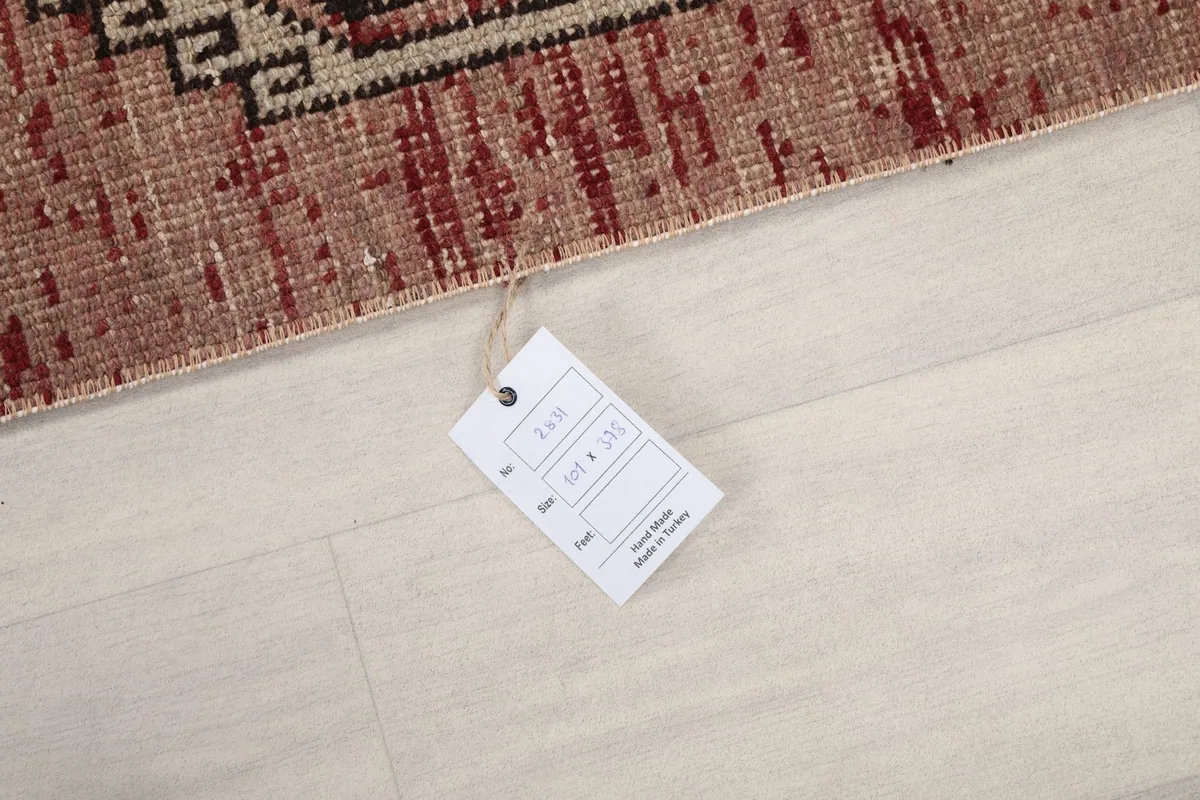 Image showing the product tag with rug dimensions and origin information.