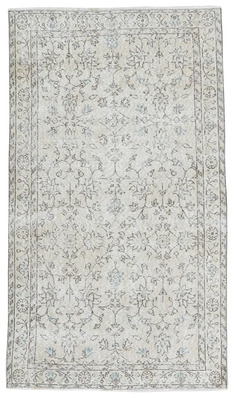 Full overhead view of the beige floral Anatolian vintage area rug