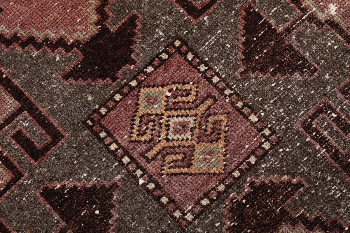 Detailed view of the intricate tribal motifs and colors in the Rose Geometric Anatolian Runner