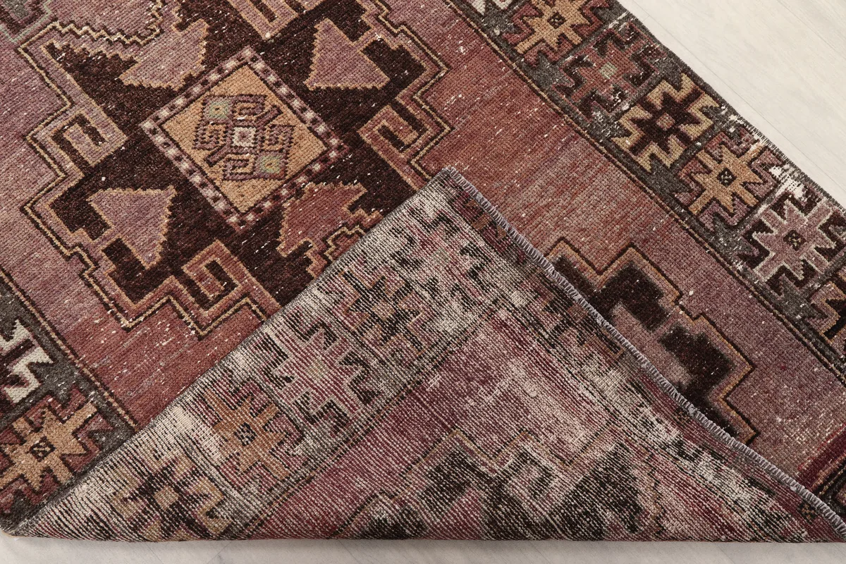 Rose Geometric Anatolian Runner folded back to show the cotton foundation
