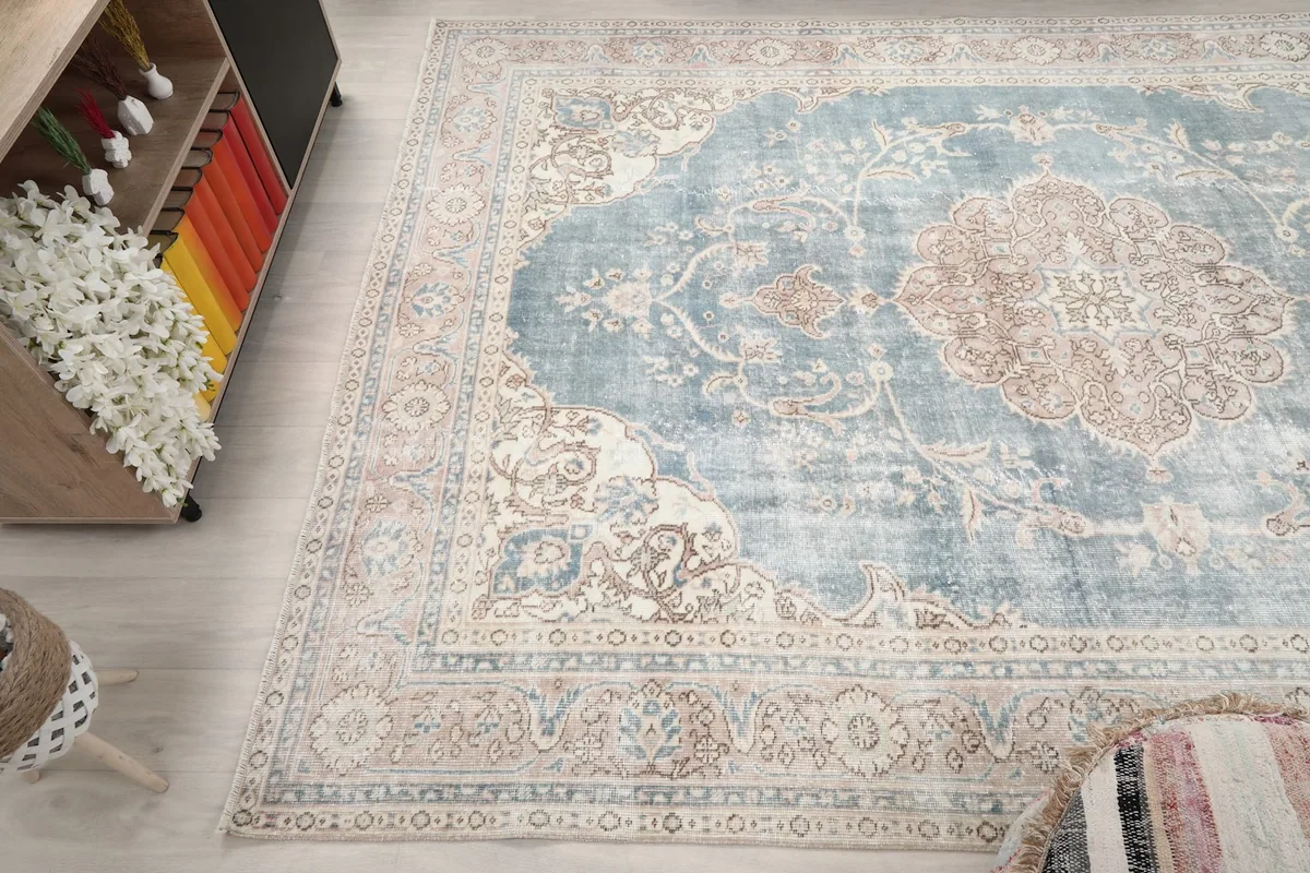 High-angle view of the rug showcasing its full pattern and distressed texture