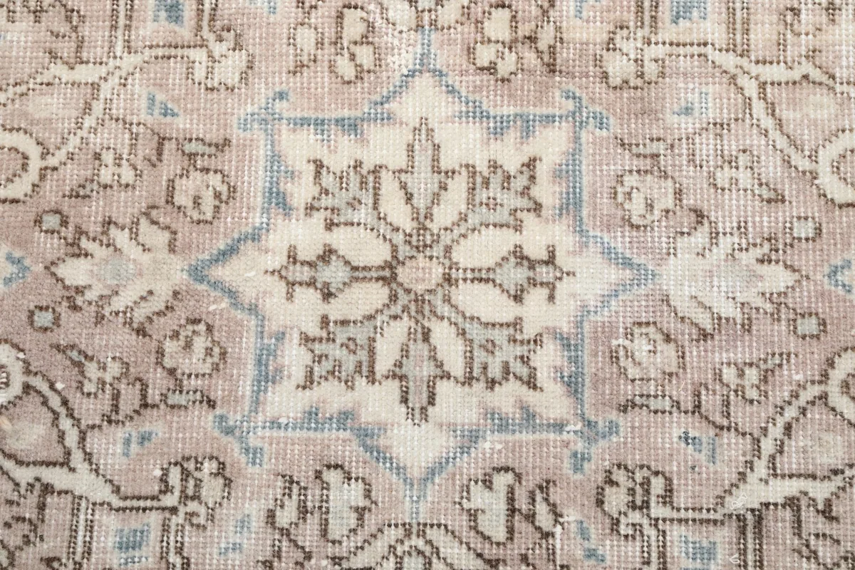 Close-up of the intricate floral and geometric pattern within the central medallion