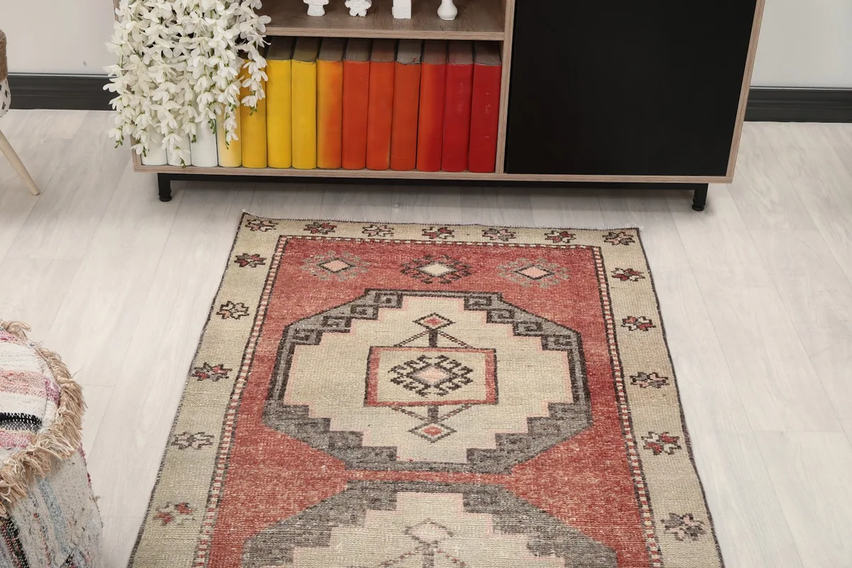 Overhead view focusing on the upper portion of the rust and beige vintage runner